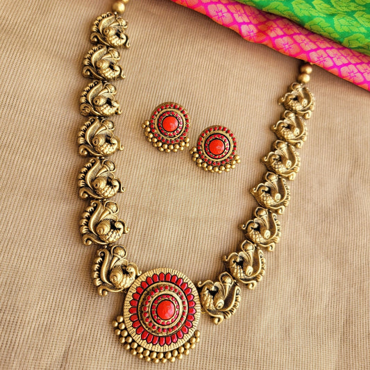 Divyani - Antique gold peacock motif necklace with red contemporary pendant terracotta jewellery with matching earrings