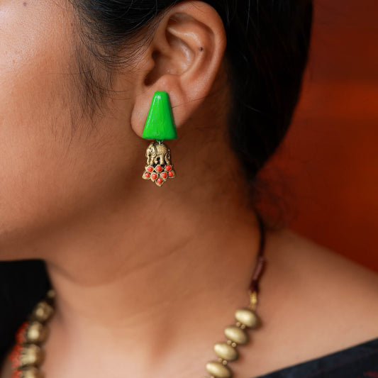 Handcrafted terracotta Lakshmi earrings close-up