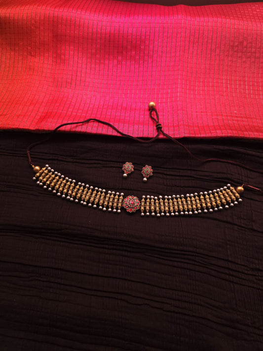 Rukmini Antique Gold Ribbed Spindle & Crimson Rosette Terracotta Choker Set