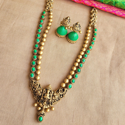 Shravyam - Two row haram in green and antique gold Lakshmi pendant terracotta jewellery with matching jumkas