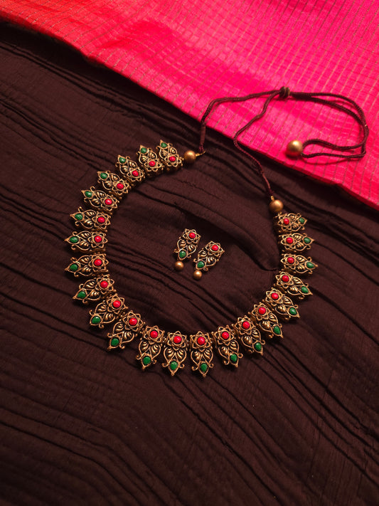 The Kirti Mukha Antique Gold & Tri-Color Floral Crest Terracotta Set