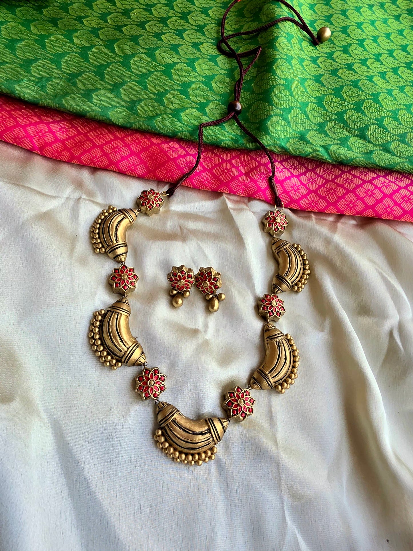 Cocoon antique gold and red terracotta jewellery