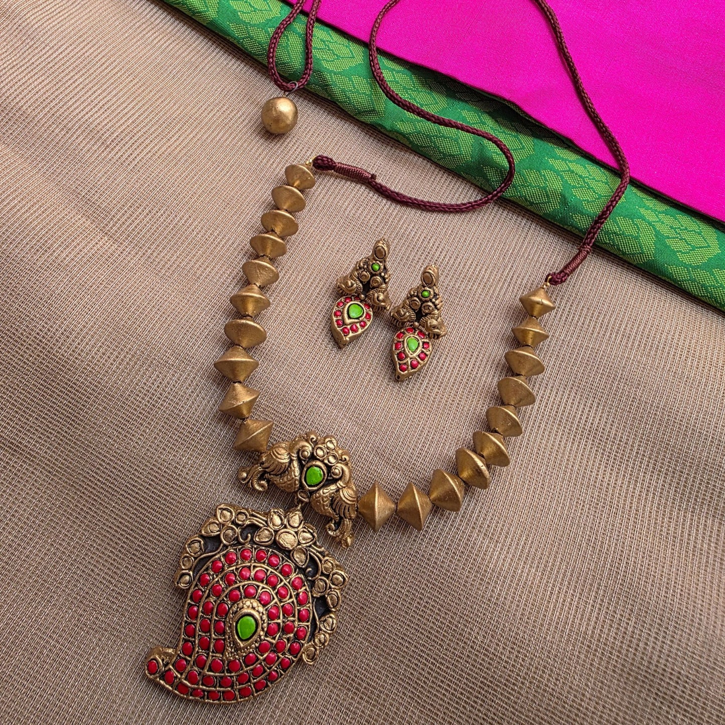 Kemp Mango Double peacock pendant with antique Gold Bicone Terracotta Jewellery