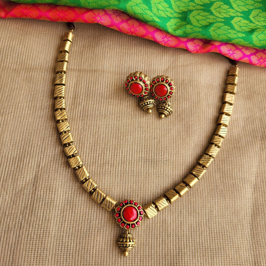 Amudhaa - Antique gold flat designer tube necklace with red hue pendant terracotta jewellery with matching studs