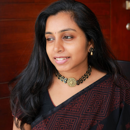 Ektara - Black and gold contemprary choker necklace with mandala motif pendant with matching earrings