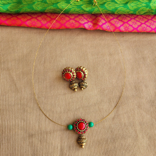 Hand-painted floral terracotta pendant close-up