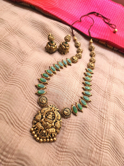 Gaja Lakshmi Antique Gold Peacock Frame & Emerald Green Terracotta Temple Set