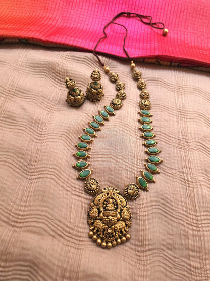 Gaja Lakshmi Antique Gold Peacock Frame & Emerald Green Terracotta Temple Set