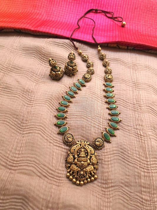 Gaja Lakshmi Antique Gold Peacock Frame & Emerald Green Terracotta Temple Set