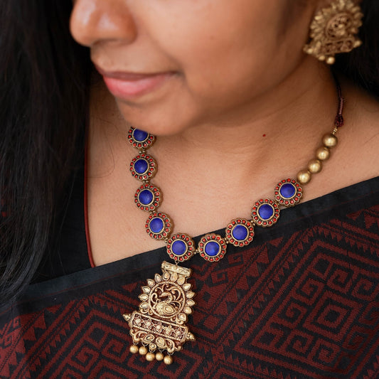 Geetham - Red and blue floral motif necklace with antique gold peacock peandant terracotta jewellery with matching studs