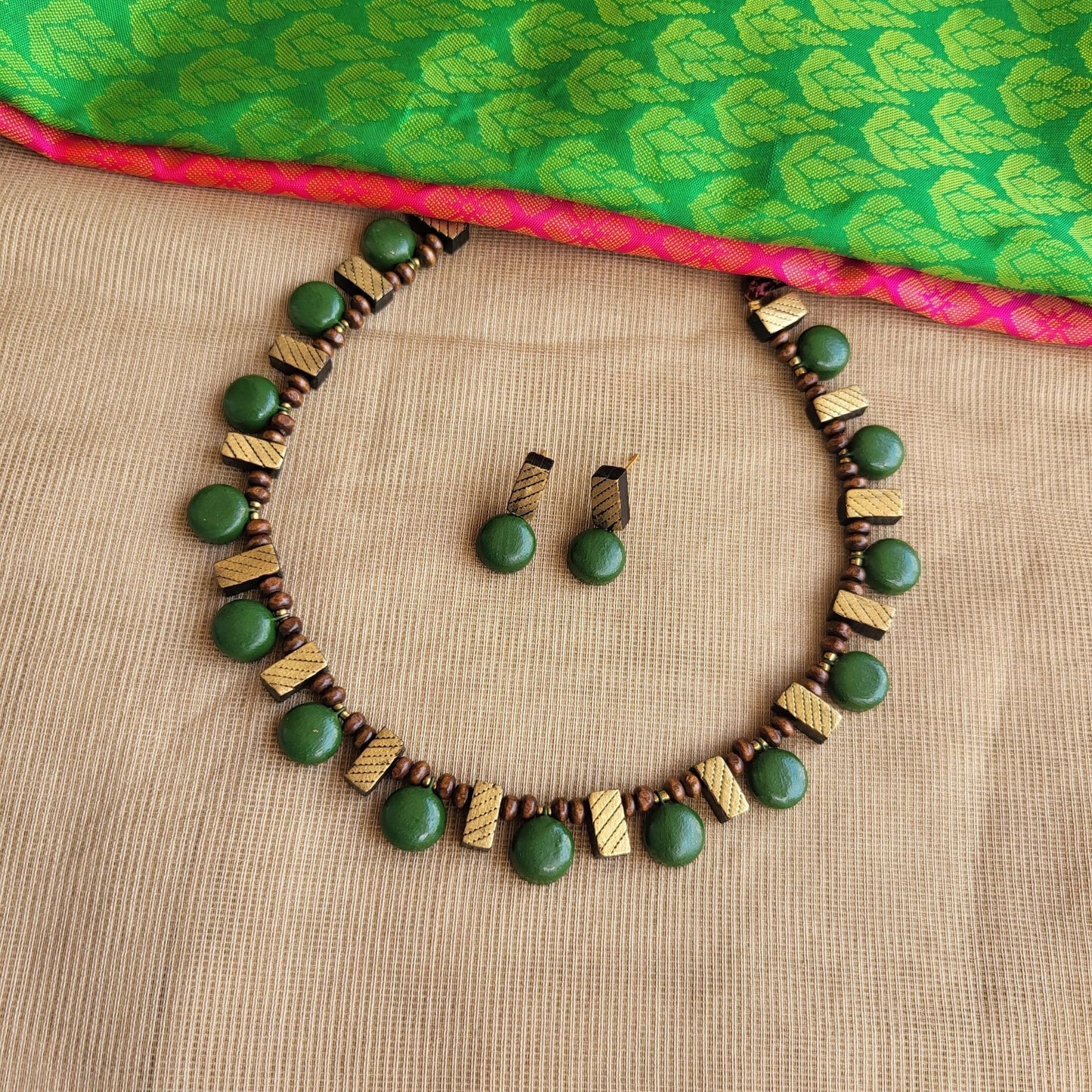 Handcrafted terracotta rectangle pattern jewellery close-up