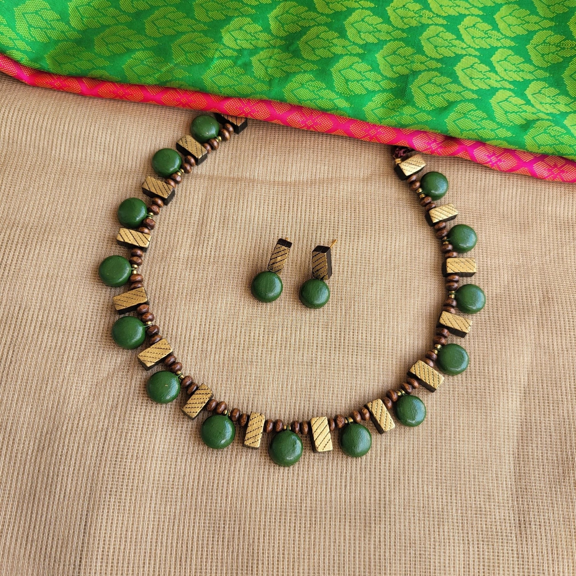 Handcrafted terracotta rectangle pattern jewellery close-up