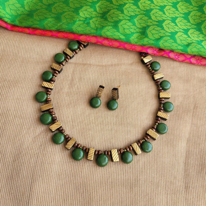 Handcrafted terracotta rectangle pattern jewellery close-up