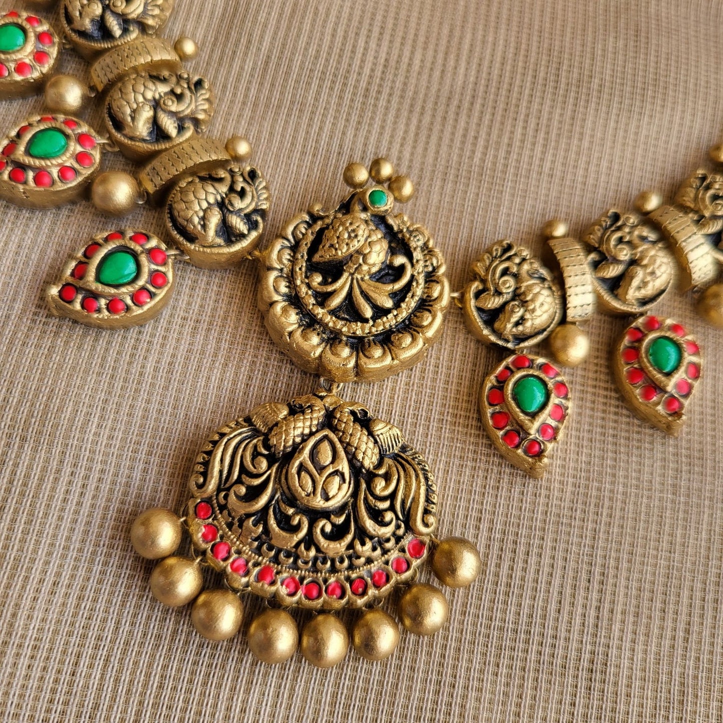 Ilaya terracotta necklace and earrings set with vibrant antique gold finish