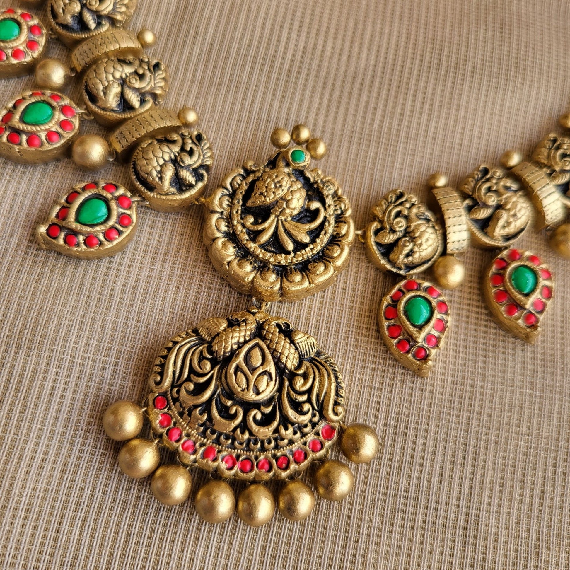 Ilaya terracotta necklace and earrings set with vibrant antique gold finish