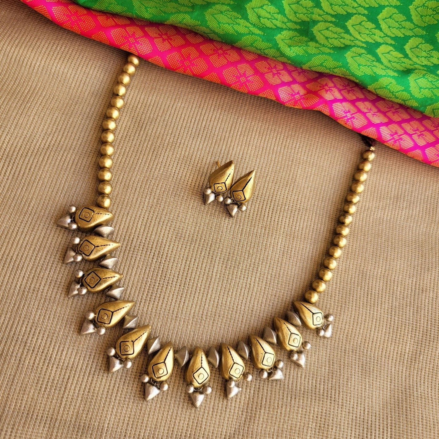 Modern artisan terracotta earrings with gold and silver accents