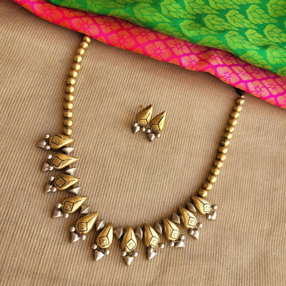 Modern artisan terracotta earrings with gold and silver accents