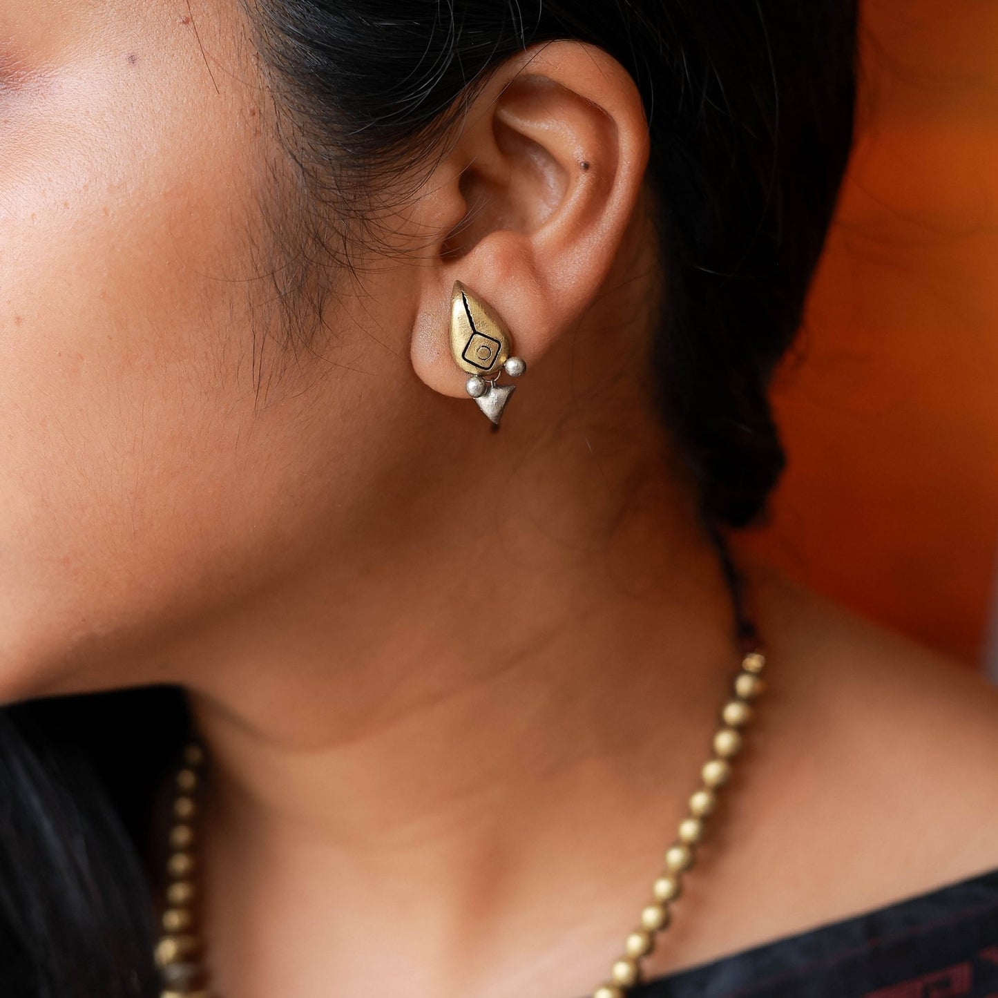 Ishara dual-tone terracotta earrings gold silver drop design