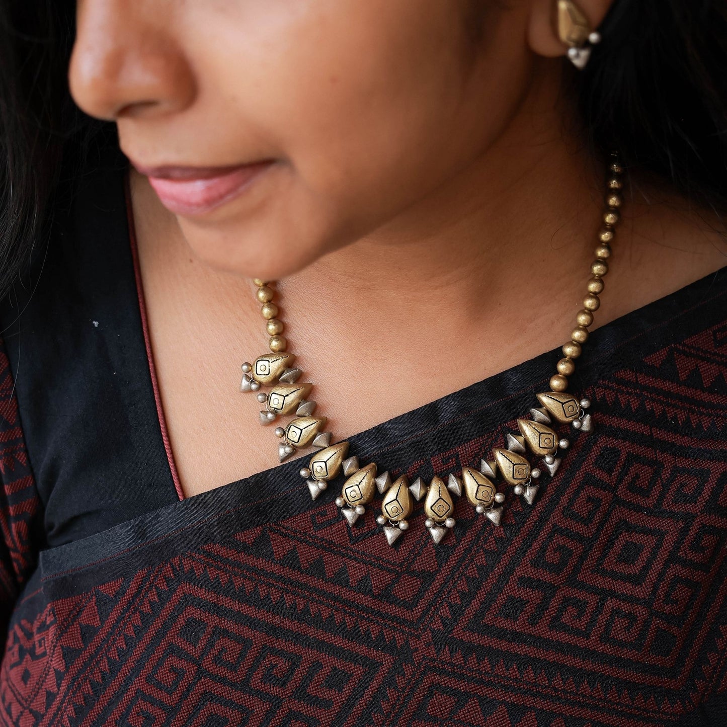 Ishara dual-tone terracotta earrings gold silver drop design