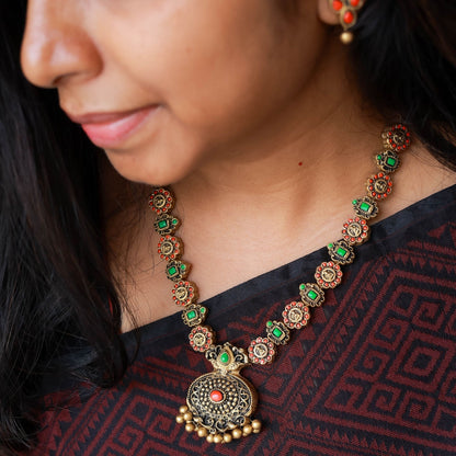 Karigai terracotta Lakshmi coin pendant orange green geometric design