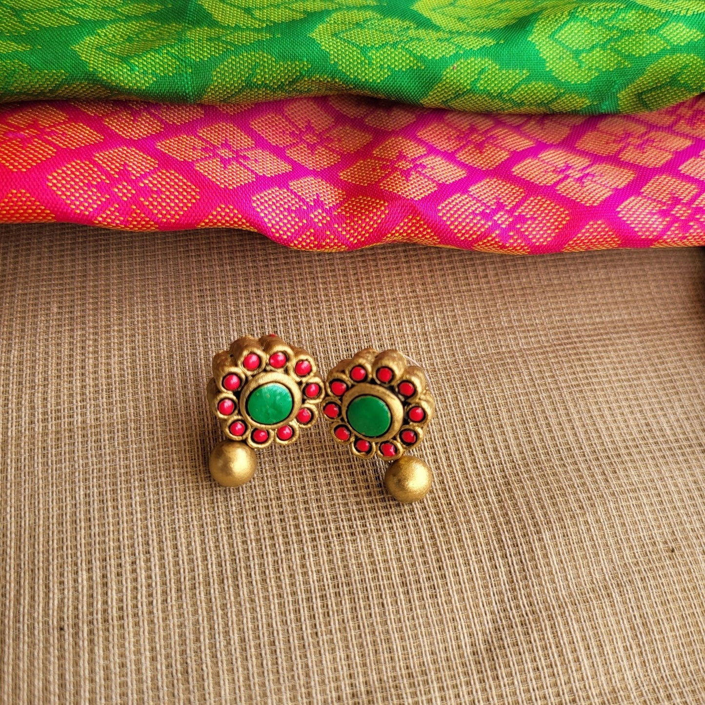 Lightweight handmade terracotta earrings with floral detailing
