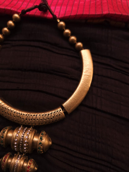 Malini Antique Gold Rigid Hasli & Multi-Tiered Drum Bead Terracotta Set
