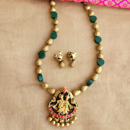 Antique gold raindrop & green disc beads