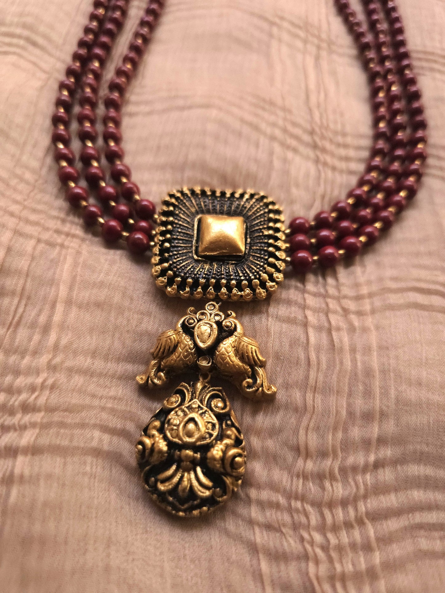 Mayura Antique Gold Peacock Emblem & Three-Layer Crimson Terracotta Set