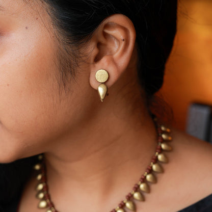 Handcrafted golden terracotta drop design close-up