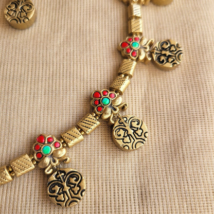 Floral and coin motif terracotta necklace close-up