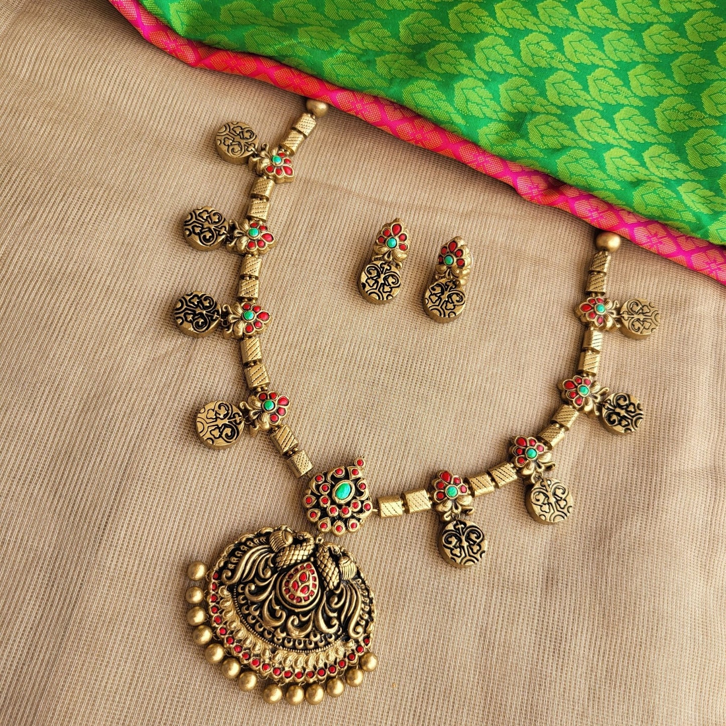 Antique gold peacock pendant handcrafted terracotta
