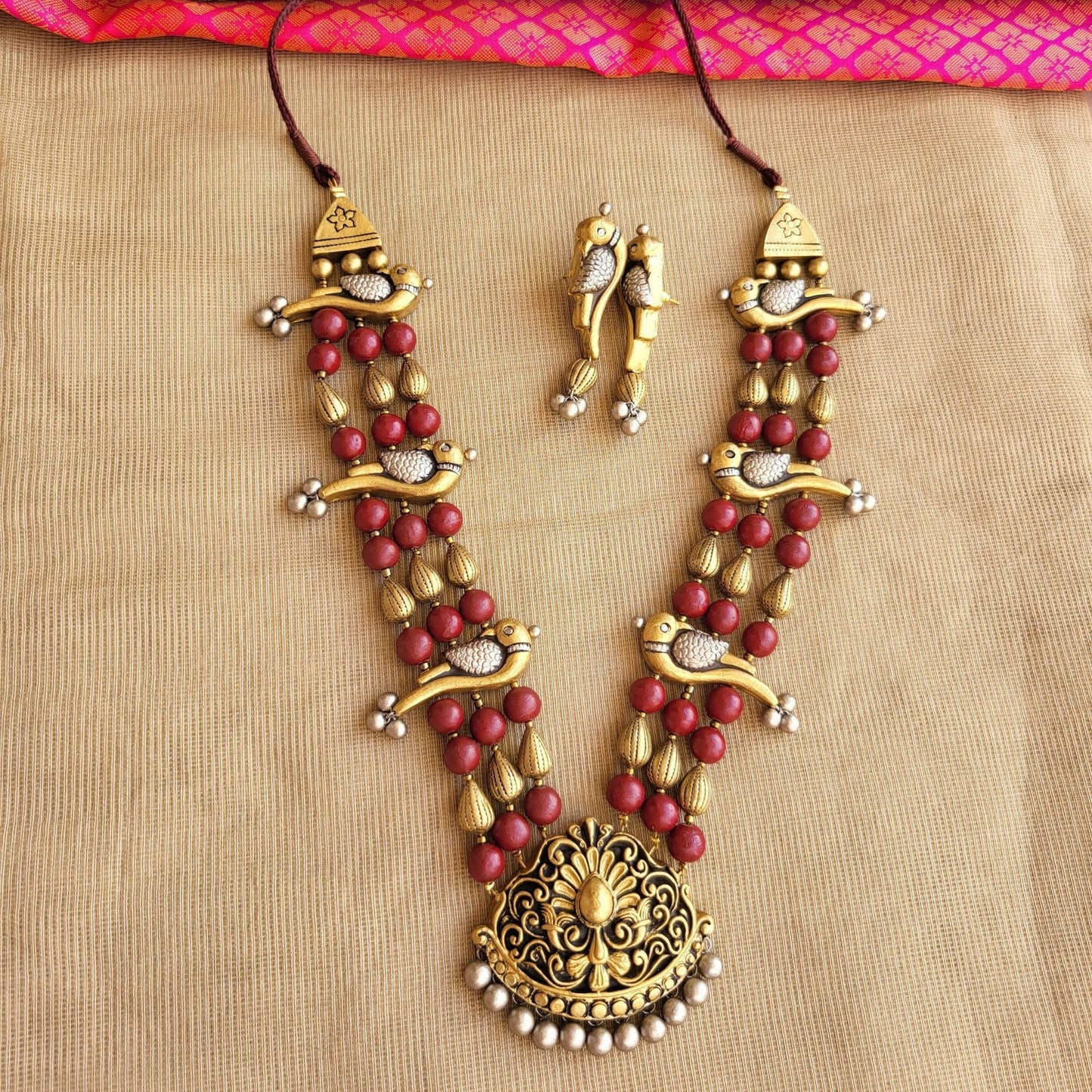 Morva terracotta parrot necklace dual-tone gold silver maroon
