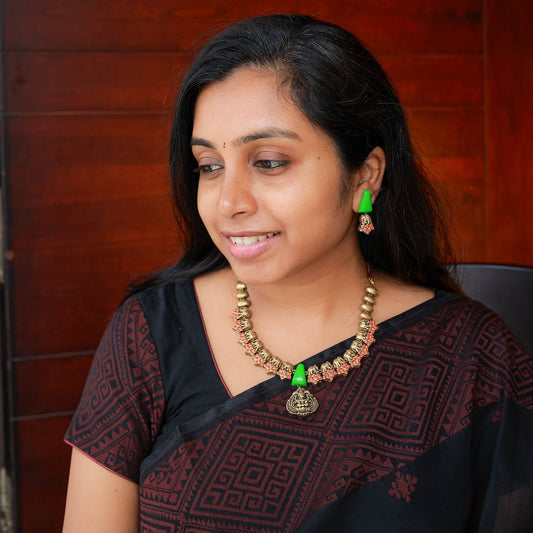 Oorvi - Orange green elephant motif necklace with Lakshmi earrings and matching earrings