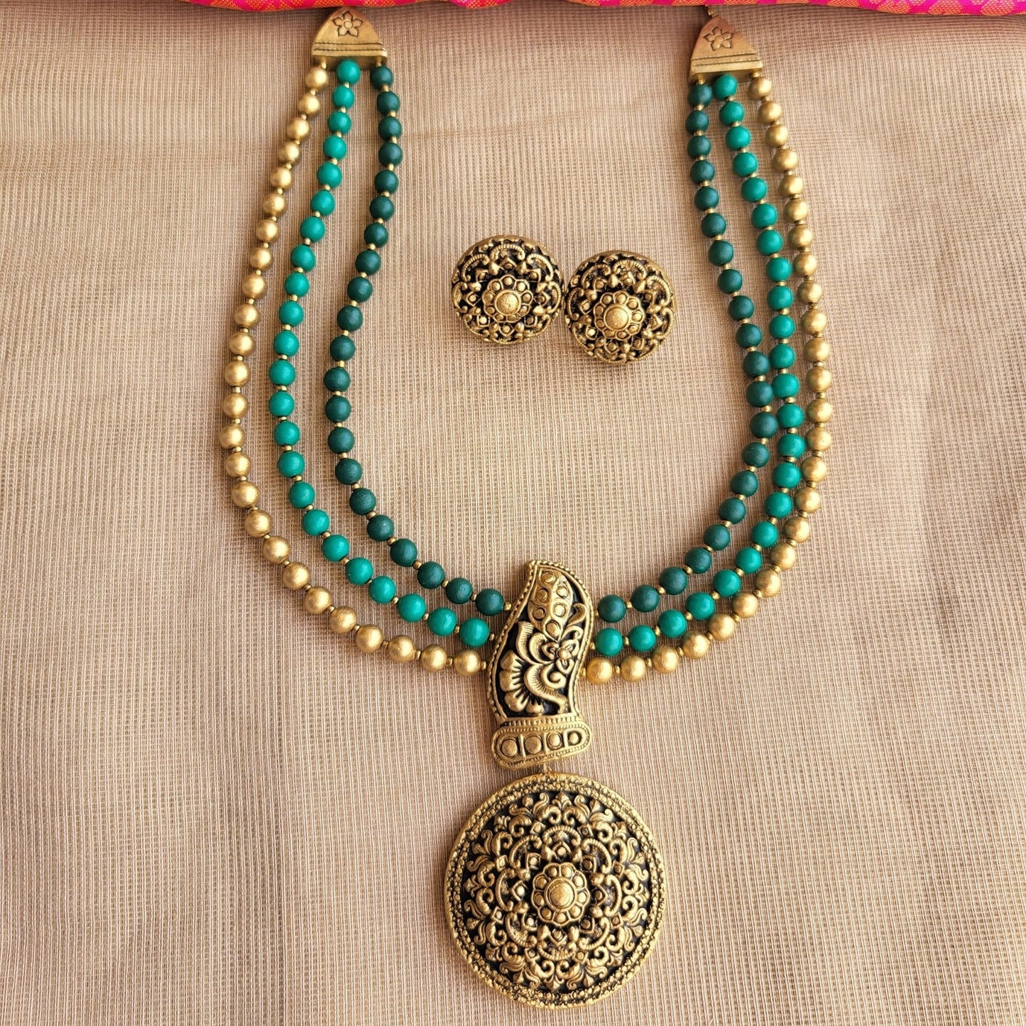 Handcrafted three-row terracotta necklace