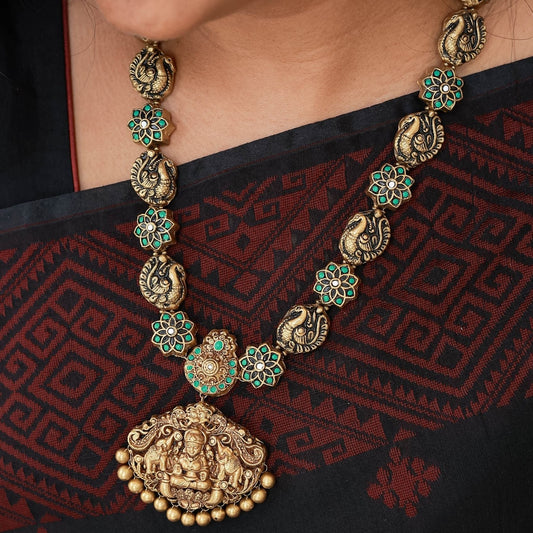 Pravisha - green, white Star flower and peacock motif necklace with anique gold lakshmi pendant terracotta jewellery with matching jumkas