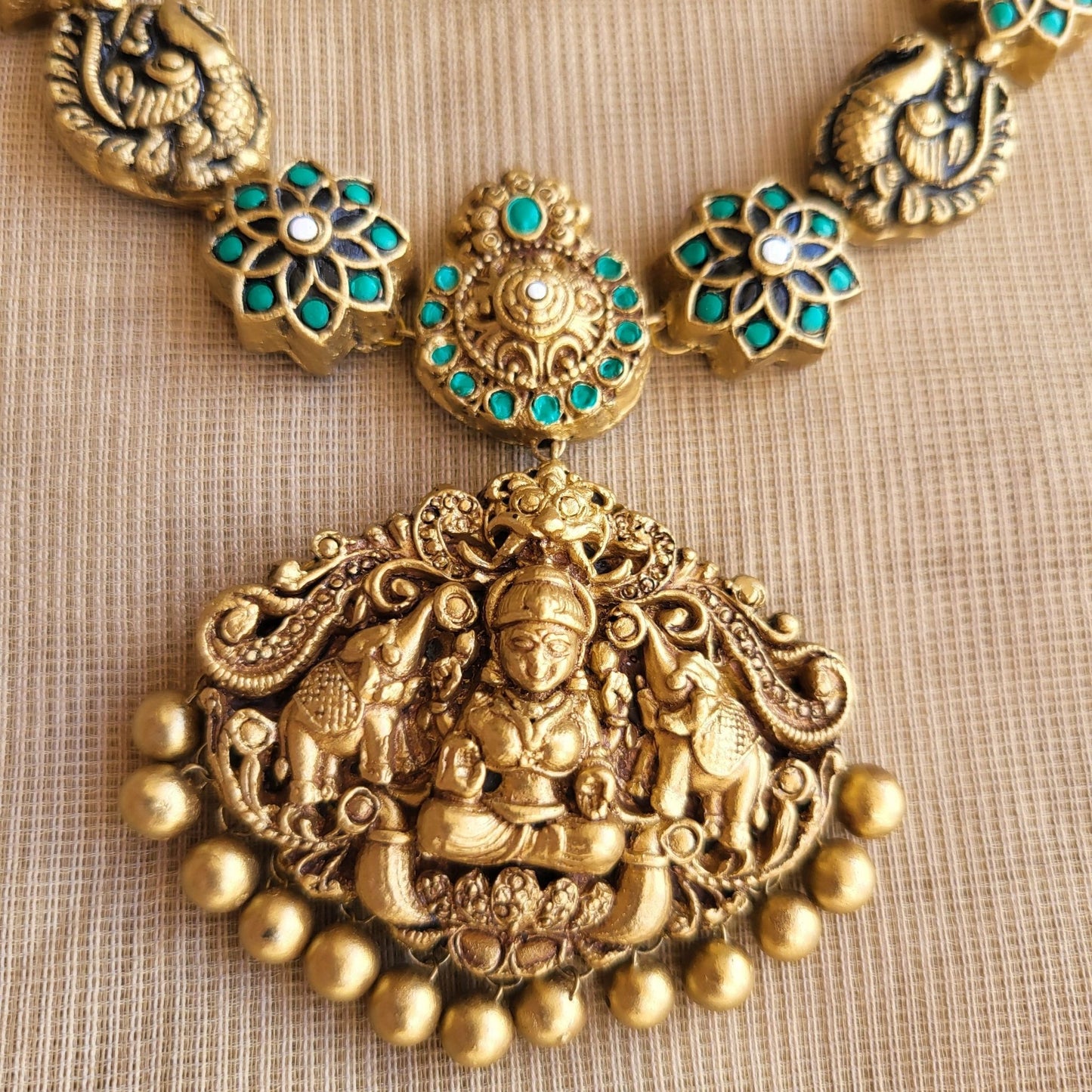 Eco-friendly Pravisha terracotta jewellery with antique gold detailing