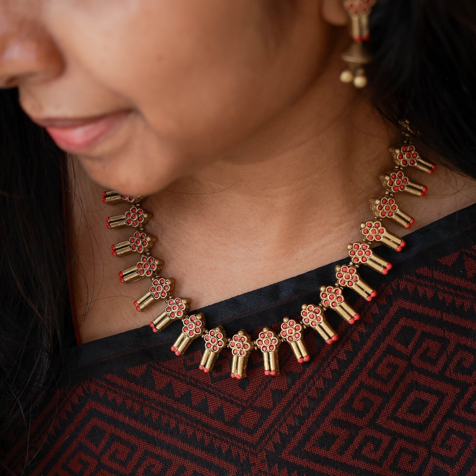 Minimalist geometric terracotta necklace close-up