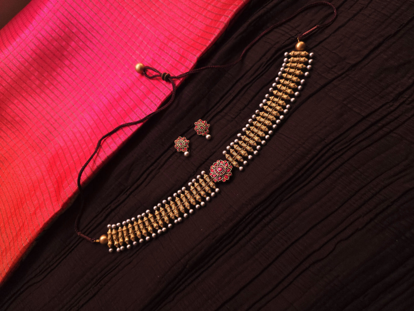 Rukmini Antique Gold Ribbed Spindle & Crimson Rosette Terracotta Choker Set