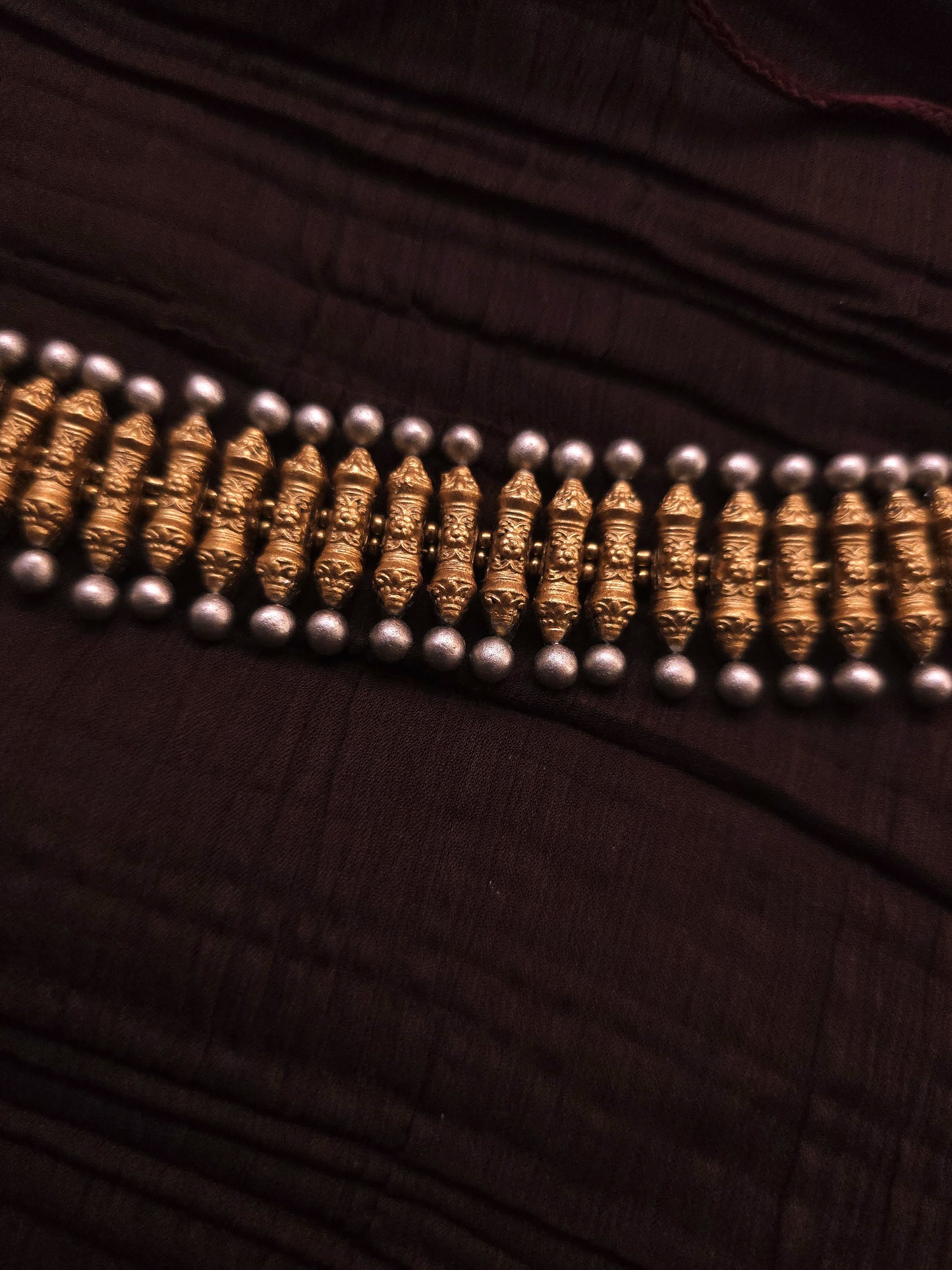 Rukmini Antique Gold Ribbed Spindle & Crimson Rosette Terracotta Choker Set