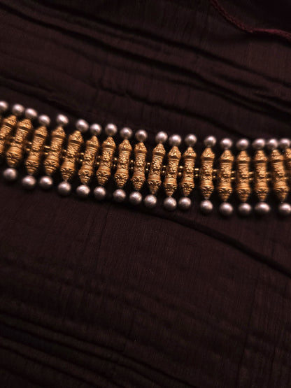 Rukmini Antique Gold Ribbed Spindle & Crimson Rosette Terracotta Choker Set