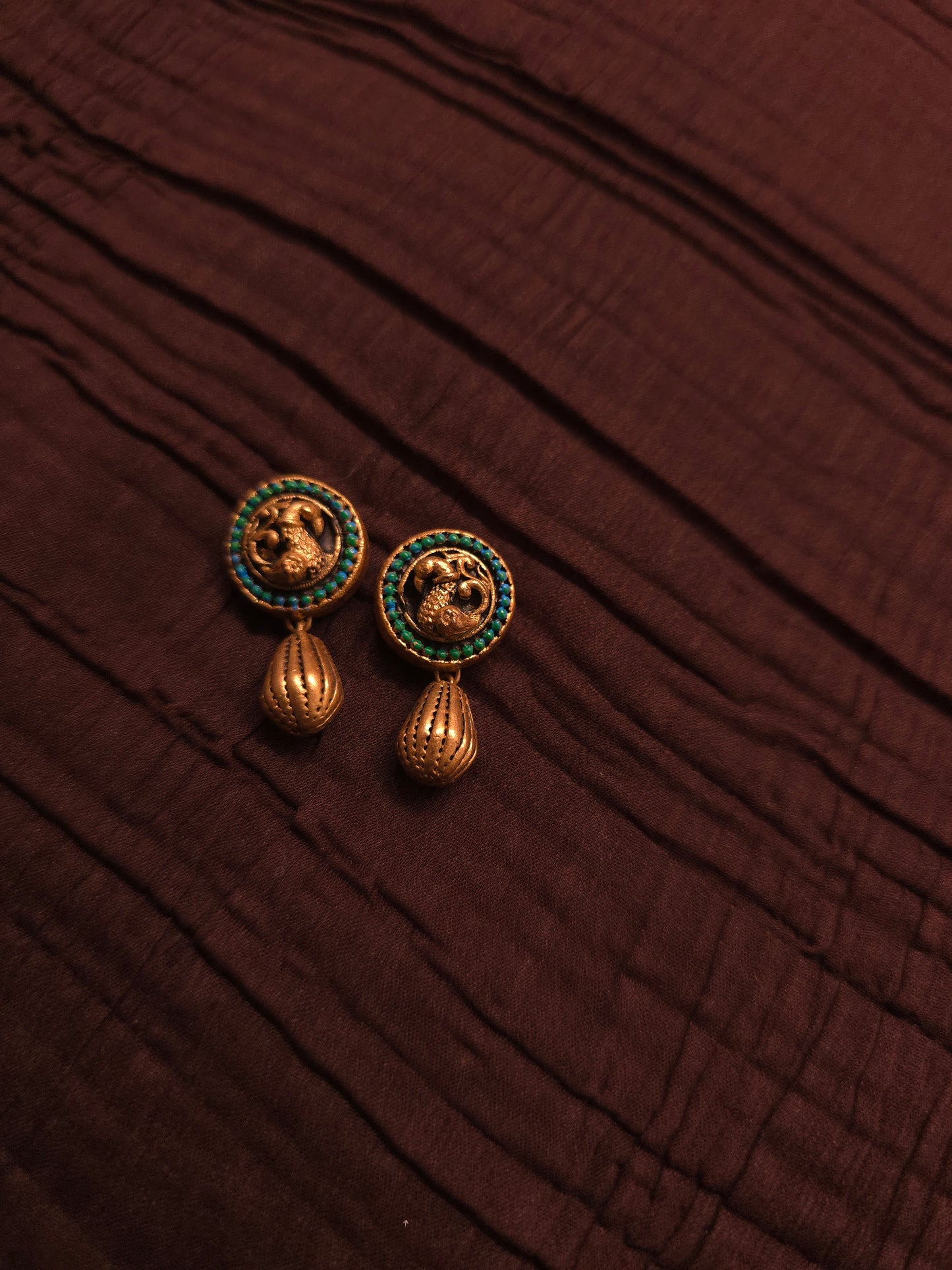 The Crimson Mayura Antique Gold & Ruby Peacock Terracotta Set