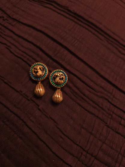 The Crimson Mayura Antique Gold & Ruby Peacock Terracotta Set