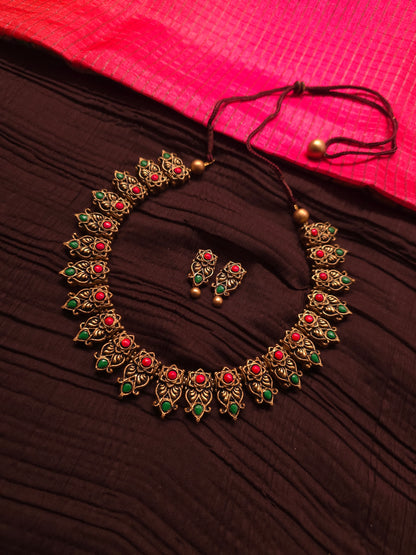 The Kirti Mukha Antique Gold & Tri-Color Floral Crest Terracotta Set