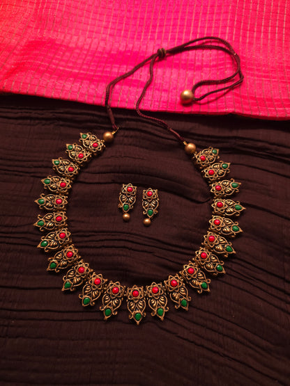 The Kirti Mukha Antique Gold & Tri-Color Floral Crest Terracotta Set