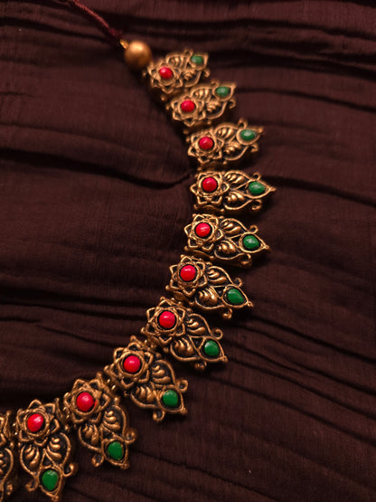 The Kirti Mukha Antique Gold & Tri-Color Floral Crest Terracotta Set