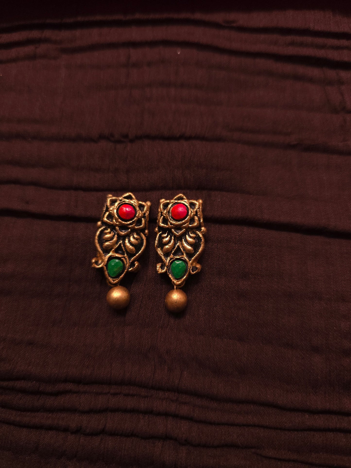 The Kirti Mukha Antique Gold & Tri-Color Floral Crest Terracotta Set