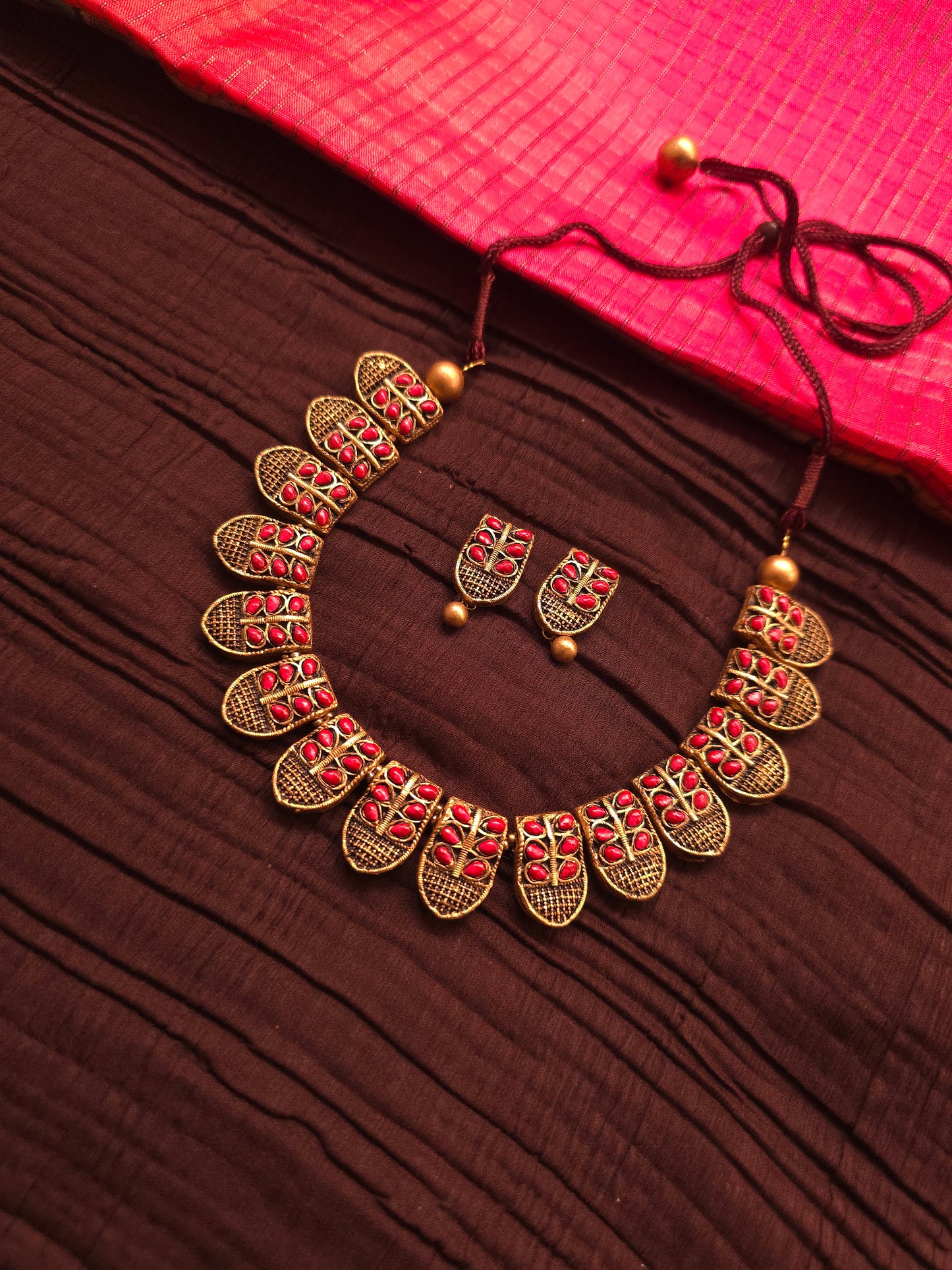 The Shani Archana Antique Gold Mesh & Crimson Leaf Terracotta Set