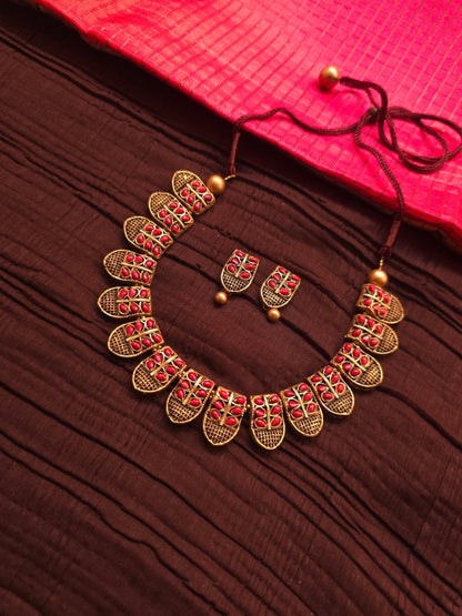 The Shani Archana Antique Gold Mesh & Crimson Leaf Terracotta Set