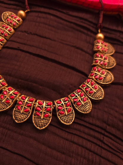 The Shani Archana Antique Gold Mesh & Crimson Leaf Terracotta Set