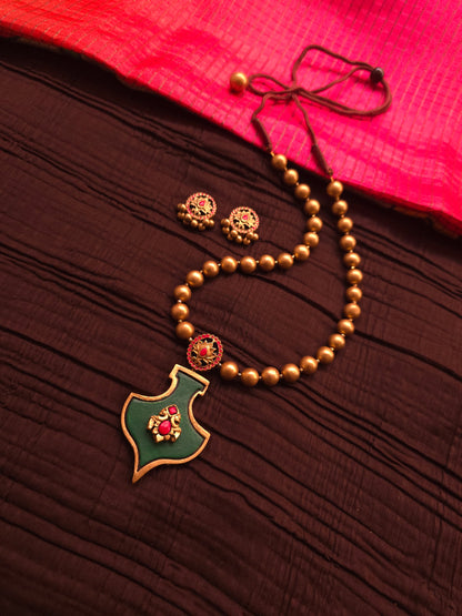 The Shield of Ganesha Antique Gold & Forest Green Terracotta Set
